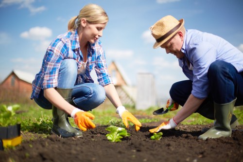 Gardening crew reviewing safety documents and waste sorting